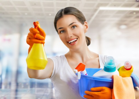 Carpet cleaning technician preparing equipment with safety focus
